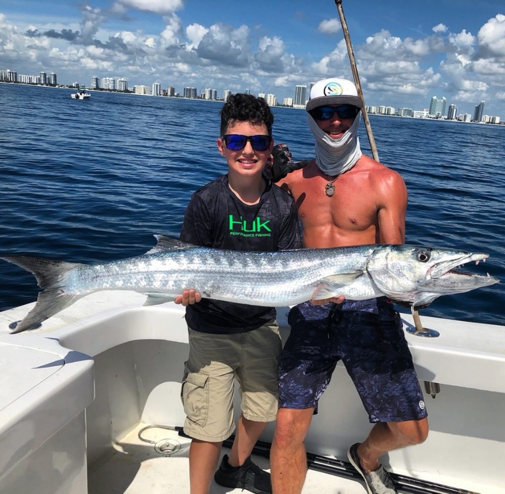 kids with wahoo fish